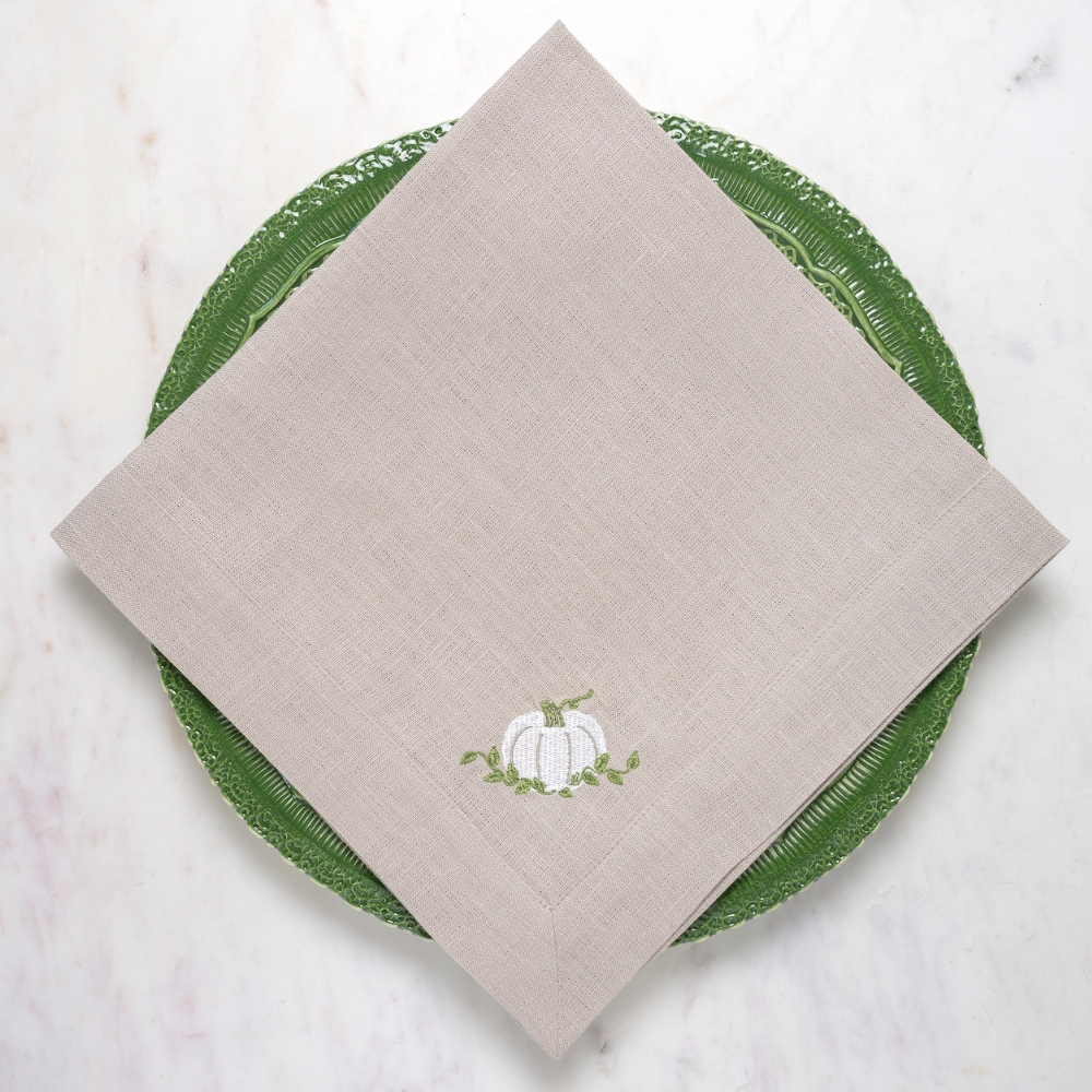 Introduce timeless elegance to your home with Crown Linen Designs Pumpkin Large Napkin. Adorned with exquisite white pumpkin embroidery, this napkin comes in natural linen. Pair with a runner, table topper or placemats for a complete look. Made in Italy, machine wash and dry flat for a crisp finish.