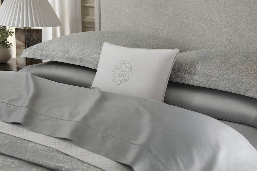 Experience the spellbinding beauty of Bione with our luxurious Duvet Covers + Shams. Crafted in Italy, the exquisite yarn-dyed sateen jacquard showcases a rich textural pattern in a palette of slate blue, taupe, and grey. Made with 100% long-staple cotton, this soft and medium-weight fabric invites you to explore its tactile allure.