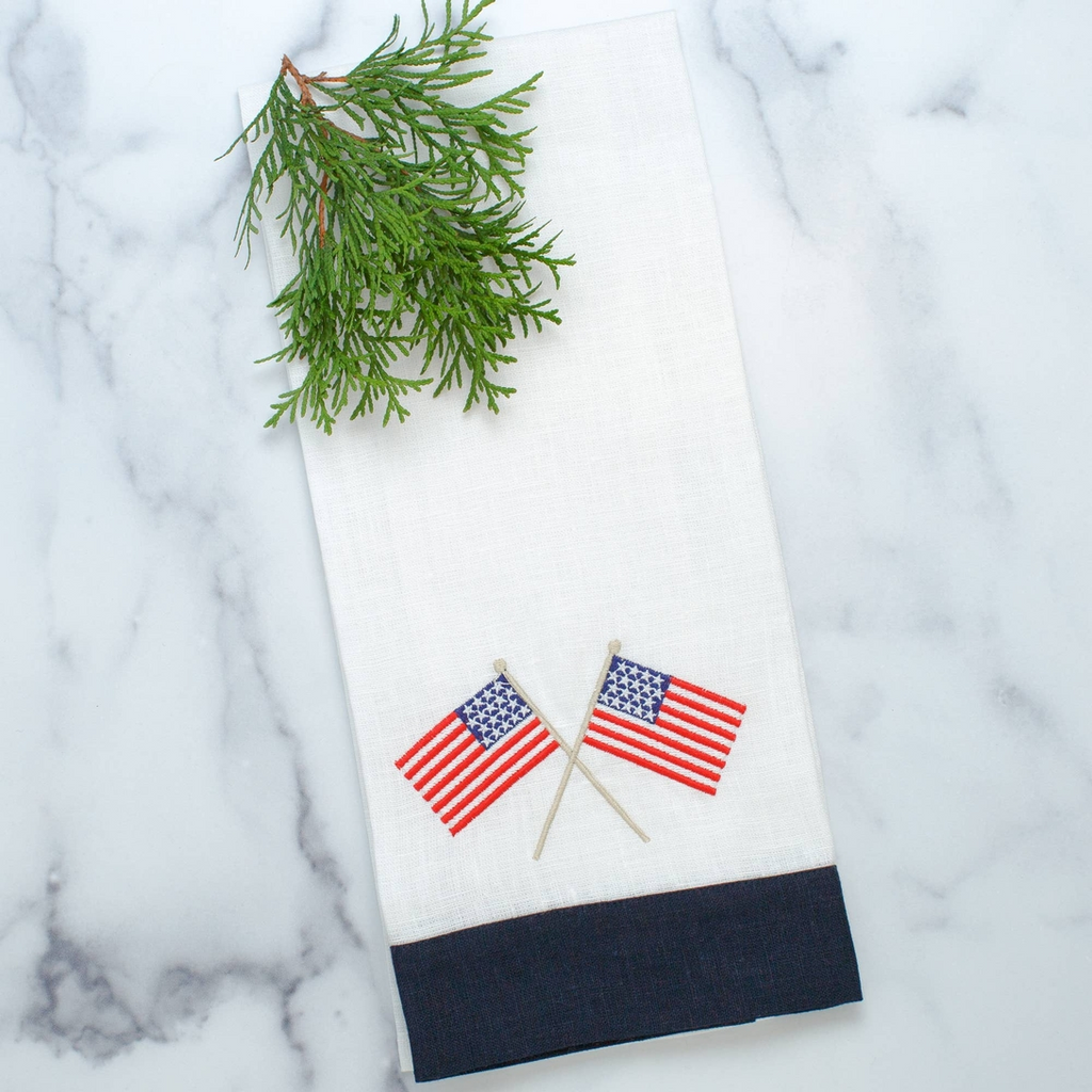 This American Flag Linen Towel is a must-have for any home. Made from 100% European linen and embroidered with delicate American flags, this guest towel is a perfect addition to your kitchen or bath. Measuring 17x29", it's a versatile way to add a touch of patriotism to any space. Made in Ukraine.