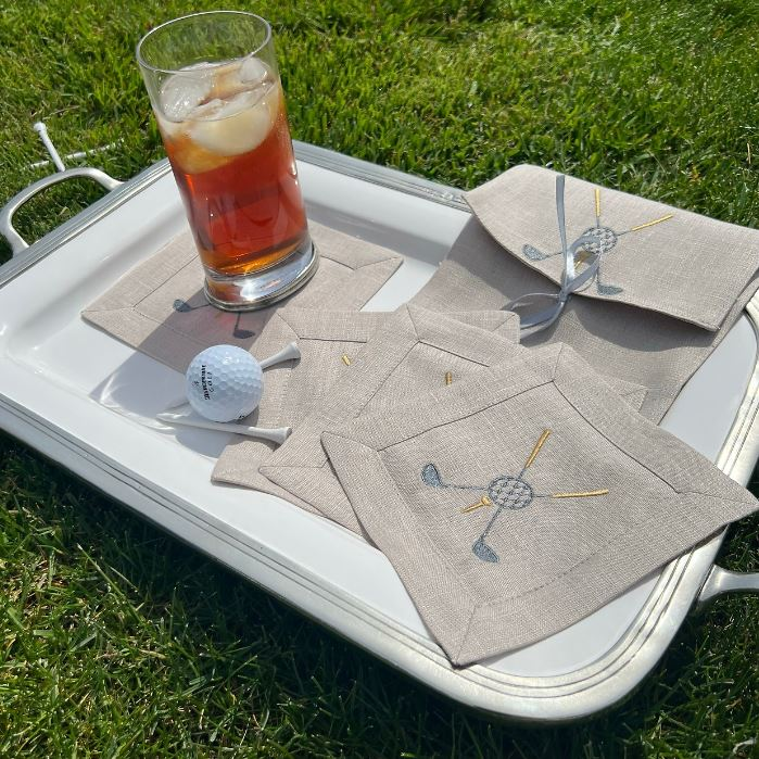 Upgrade your cocktail game with our Golf Cocktail Napkin Set. Each of the four 6"x6" linen napkins is embroidered with a timeless golf motif, adding an elegant touch to your table. Made in Italy and packaged in a linen pouch, it makes the perfect gift for any golf enthusiast.