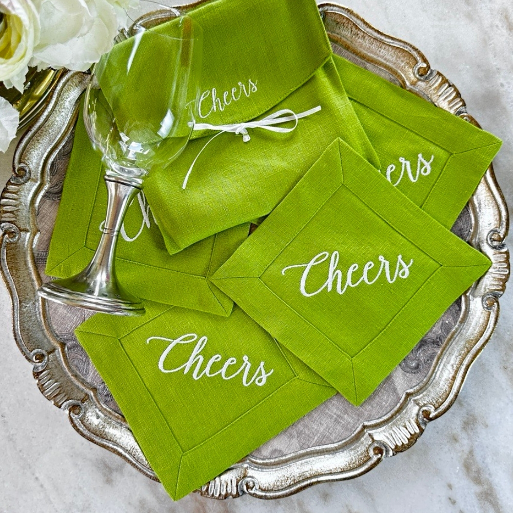 Elevate your cocktail hour with our Cheers Cocktail Napkin Set. Made from 100% European white linen, these elegant and sophisticated napkins are embroidered with "Cheers" and come in a linen pouch for safe keeping. Perfect for gifting, each set includes four 6" x 6" napkins. Made in Ukraine.