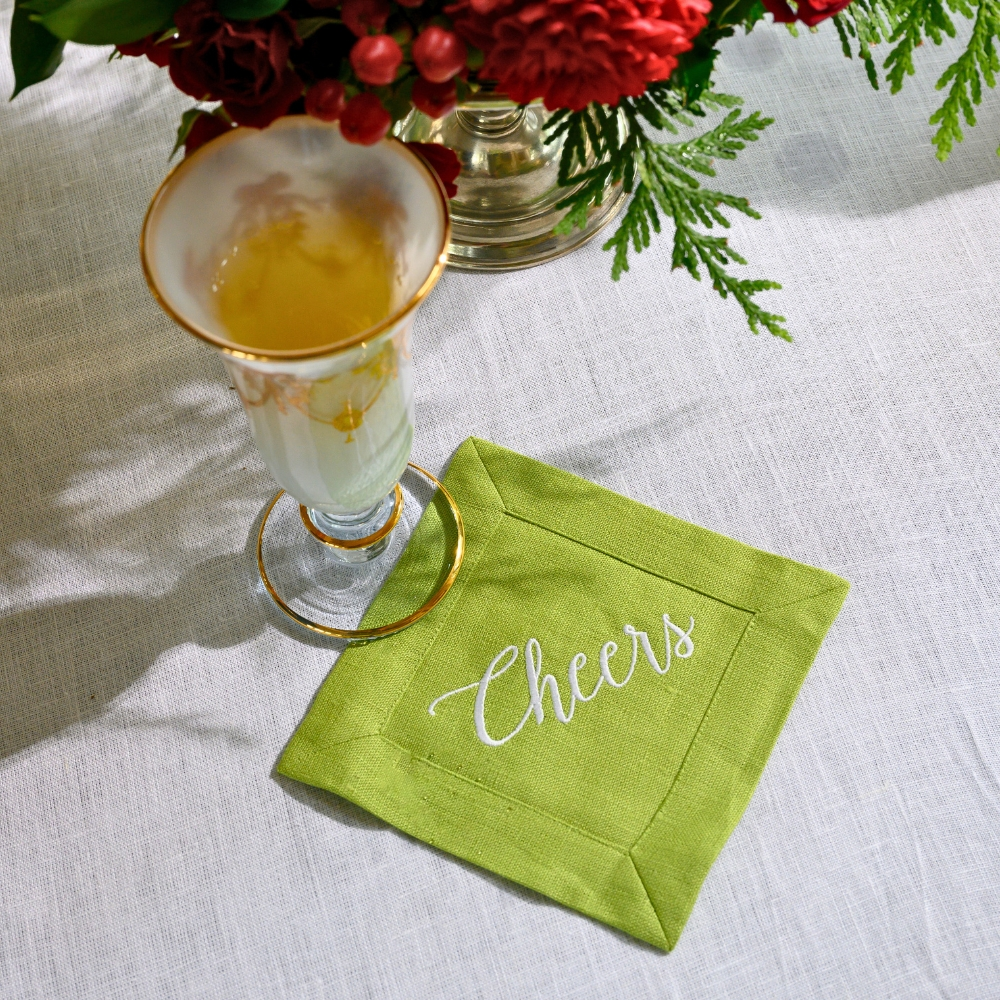 Elevate your cocktail hour with our Cheers Cocktail Napkin Set. Made from 100% European white linen, these elegant and sophisticated napkins are embroidered with "Cheers" and come in a linen pouch for safe keeping. Perfect for gifting, each set includes four 6" x 6" napkins. Made in Ukraine.