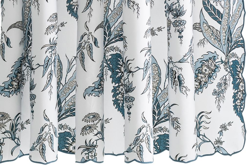 Elevate your bathroom with the Apolline Shower Curtain. Designed by Schumacher, this elegant curtain features a stunning botanical print on crisp, white Egyptian cotton. With a delicate embroidered scallop edge, it adds classic sophistication to any space. Made in the USA with OEKO-TEX® certified fabric from Italy.