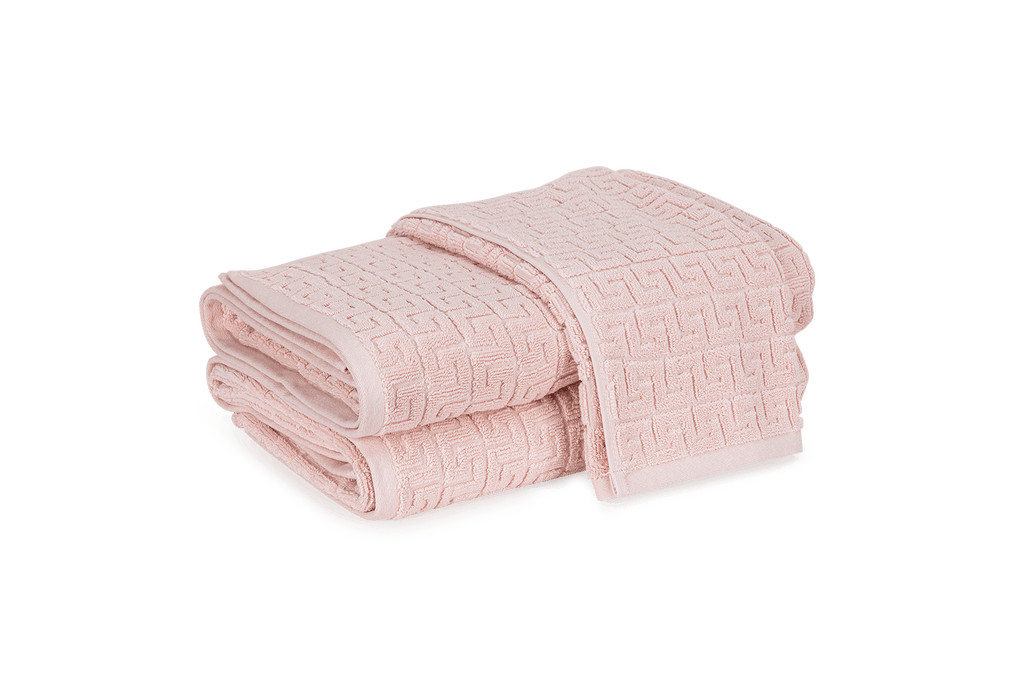 Elegant and absorbent. A timeless Greek key pattern is featured on the sculpted Athena Bath Towels and Tub Mat from Matouk. Inspired by a Schumacher fabric, these towels are available in beautiful blush pink that add classic elegance to the bathroom.