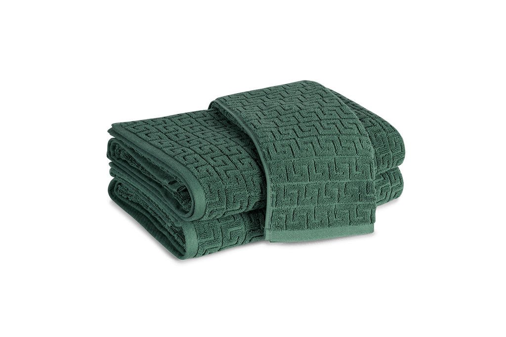 Elegant and absorbent. A timeless Greek key pattern is featured on the sculpted Athena Bath Towels and Tub Mat from Matouk. Inspired by a Schumacher fabric, these towels are available in beautiful jade green that add classic elegance to the bathroom.