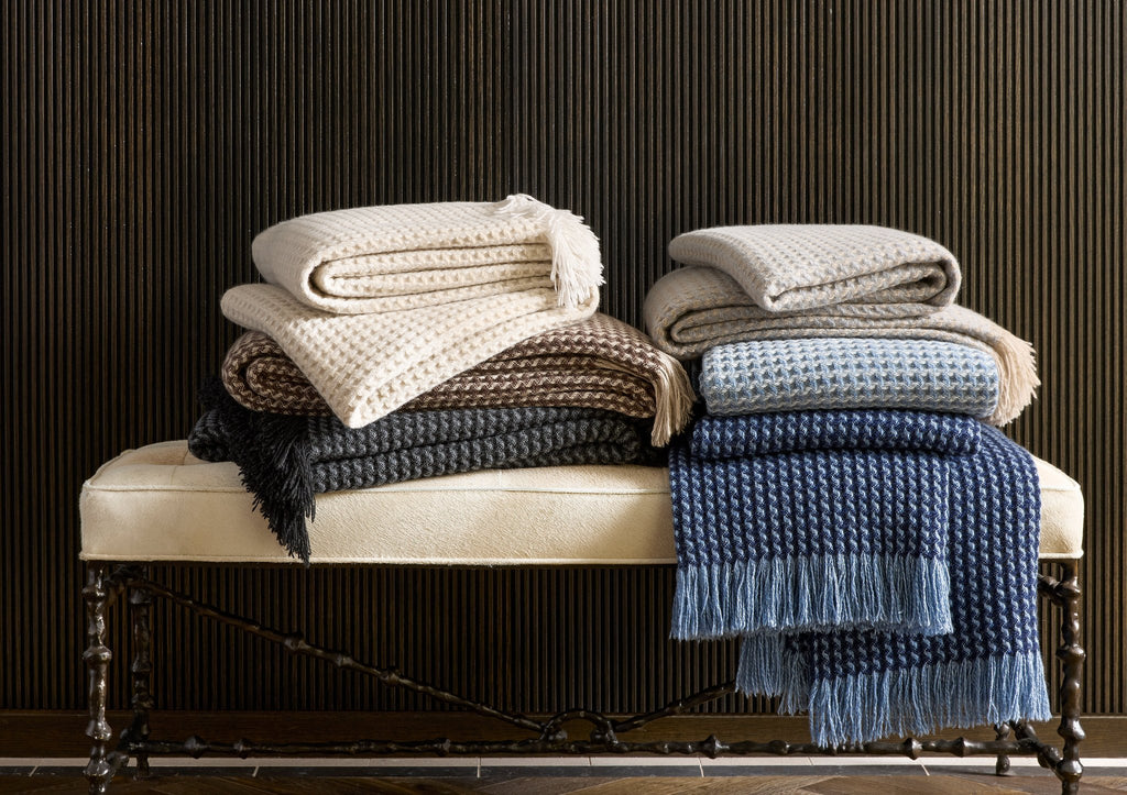 Indulge in pure luxury with the Cleo Cashmere Throw. Made from the softest 100% cashmere and washed using a special method, this oversized throw boasts extra loft and texture. With a subtle basket weave pattern, combed fringe, and understated monochromatic hues, Cleo adds elegant style to any home.