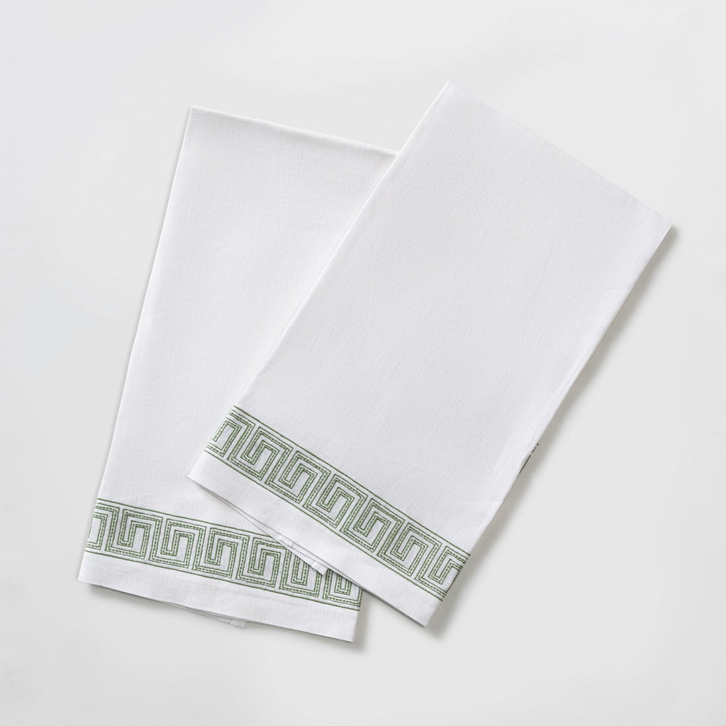 The Ophelia Guest Towels are the epitome of luxury and sophistication. Made from 100% linen, the towels feature an elegant Greek key pattern with meticulously clover green embroidered lines and dots inspired by Schumacher's beaded tape. These towels will elevate any bathroom with their classic design.