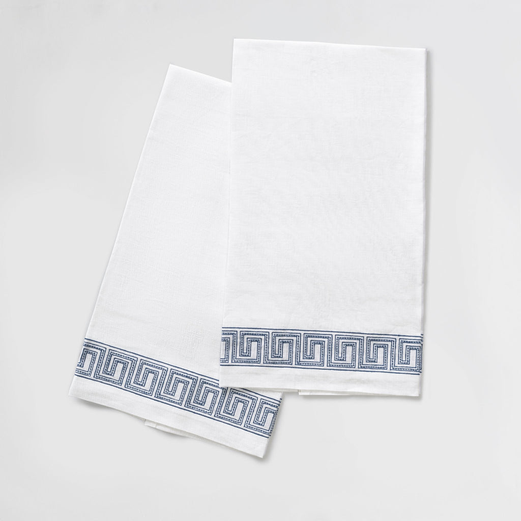 The Ophelia Guest Towels are the epitome of luxury and sophistication. Made from 100% linen, the towels feature an elegant Greek key pattern with meticulously indigo blue embroidered lines and dots inspired by Schumacher's beaded tape. These towels will elevate any bathroom with their classic design.