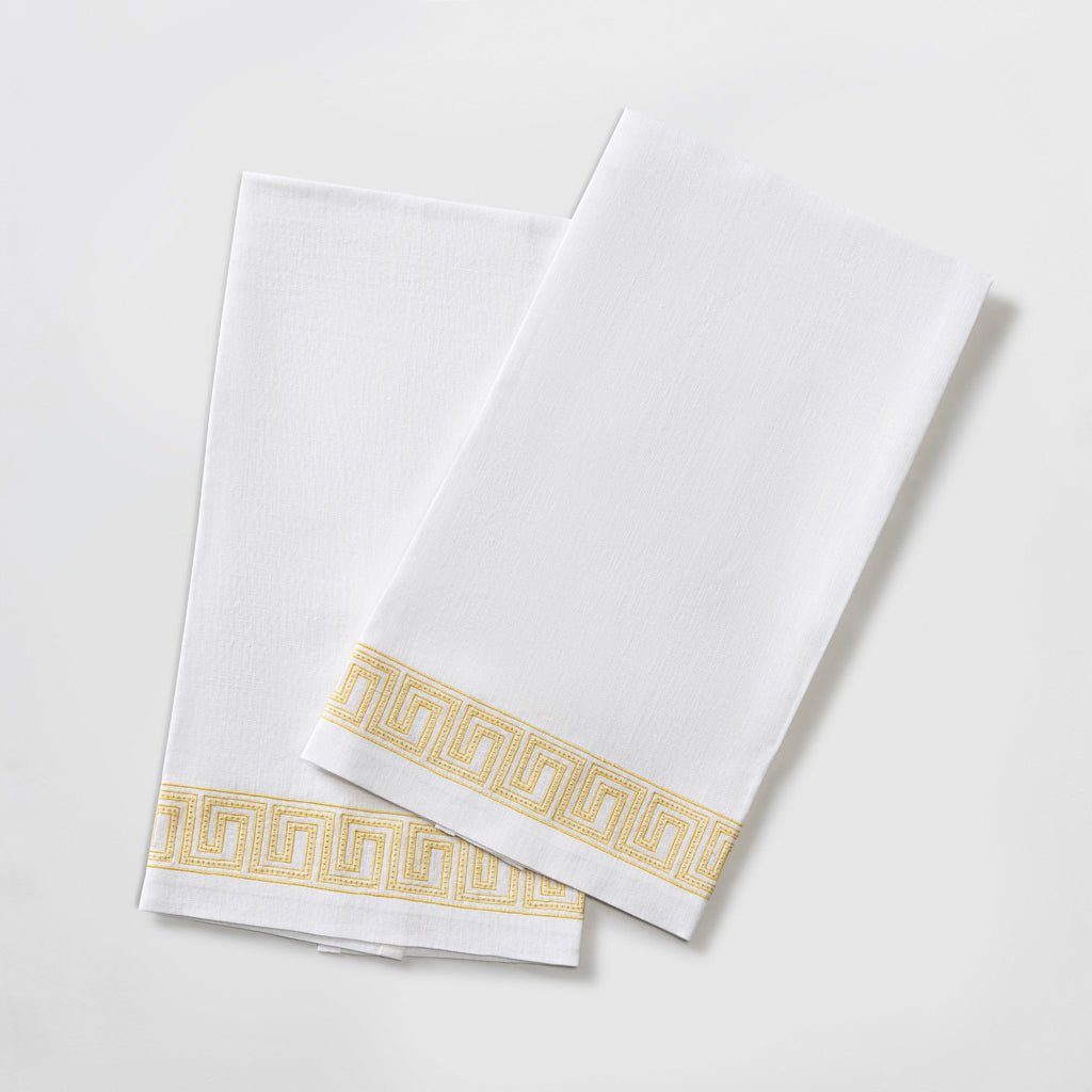 The Ophelia Guest Towels are the epitome of luxury and sophistication. Made from 100% linen, the towels feature an elegant Greek key pattern with meticulously lemon yellow embroidered lines and dots inspired by Schumacher's beaded tape. These towels will elevate any bathroom with their classic design.