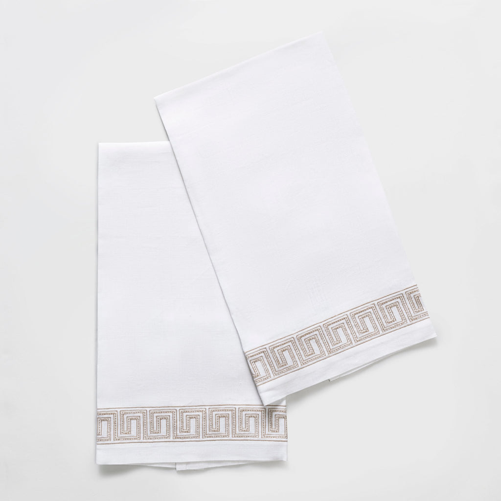 The Ophelia Guest Towels are the epitome of luxury and sophistication. Made from 100% linen, the towels feature an elegant Greek key pattern with meticulously natural linen color embroidered lines and dots inspired by Schumacher's beaded tape. These towels will elevate any bathroom with their classic design.