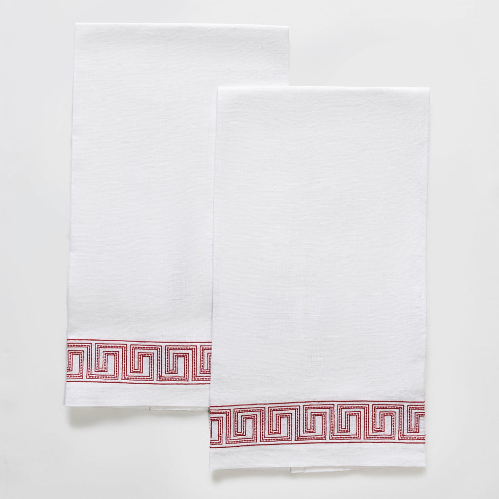 The Ophelia Guest Towels are the epitome of luxury and sophistication. Made from 100% linen, the towels feature an elegant Greek key pattern with meticulously red embroidered lines and dots inspired by Schumacher's beaded tape. These towels will elevate any bathroom with their classic design.