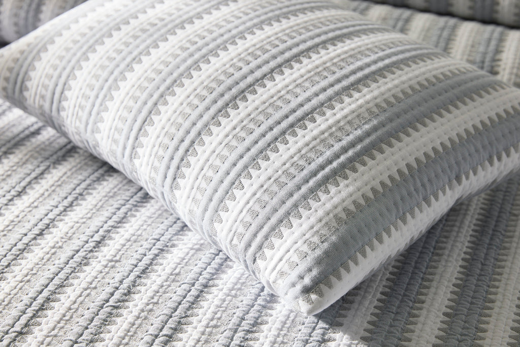 Expertly crafted in the USA with luxurious Italian fabric, Matouk's Apollo Stripe Matelassé coverlet and shams offer a comfortable and casual addition to your bedding. The 100% cotton shell and poly fill provide a minimal yet textural layer in a choice of Comet taupe or Dove blue & grey hues.