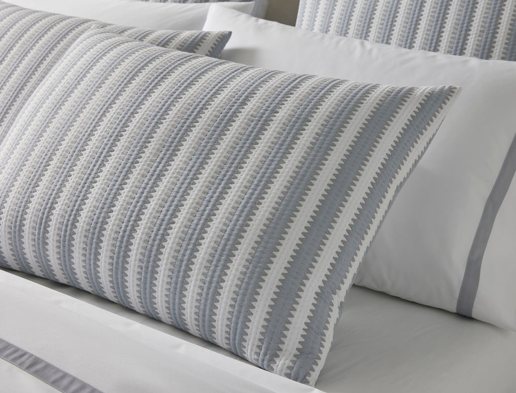 Expertly crafted in the USA with luxurious Italian fabric, Matouk's Apollo Stripe Matelassé coverlet and shams offer a comfortable and casual addition to your bedding. The 100% cotton shell and poly fill provide a minimal yet textural layer in a choice of Comet taupe or Dove blue & grey hues.