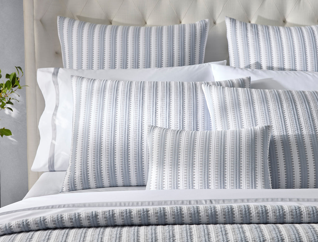 Expertly crafted in the USA with luxurious Italian fabric, Matouk's Apollo Stripe Matelassé coverlet and shams offer a comfortable and casual addition to your bedding. The 100% cotton shell and poly fill provide a minimal yet textural layer in a choice of Comet taupe or Dove blue & grey hues.