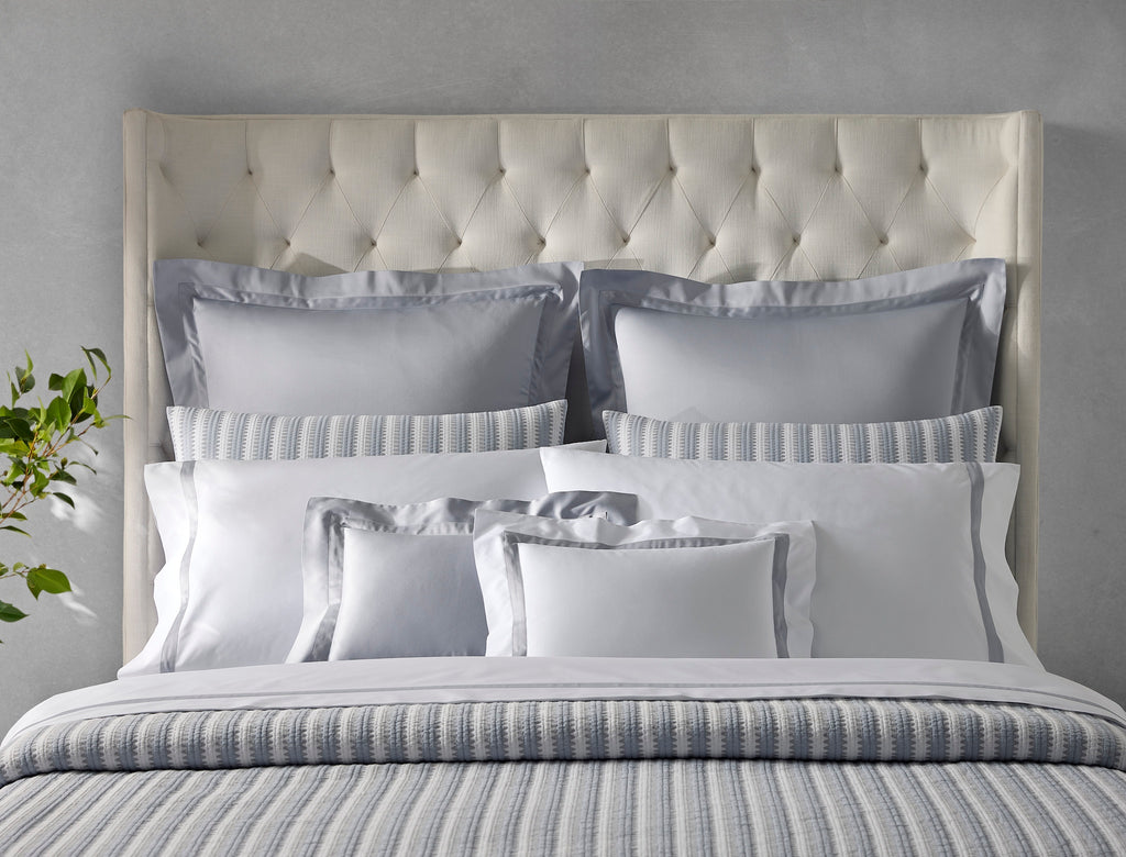 Expertly crafted in the USA with luxurious Italian fabric, Matouk's Apollo Stripe Matelassé coverlet and shams offer a comfortable and casual addition to your bedding. The 100% cotton shell and poly fill provide a minimal yet textural layer in a choice of Comet taupe or Dove blue & grey hues.