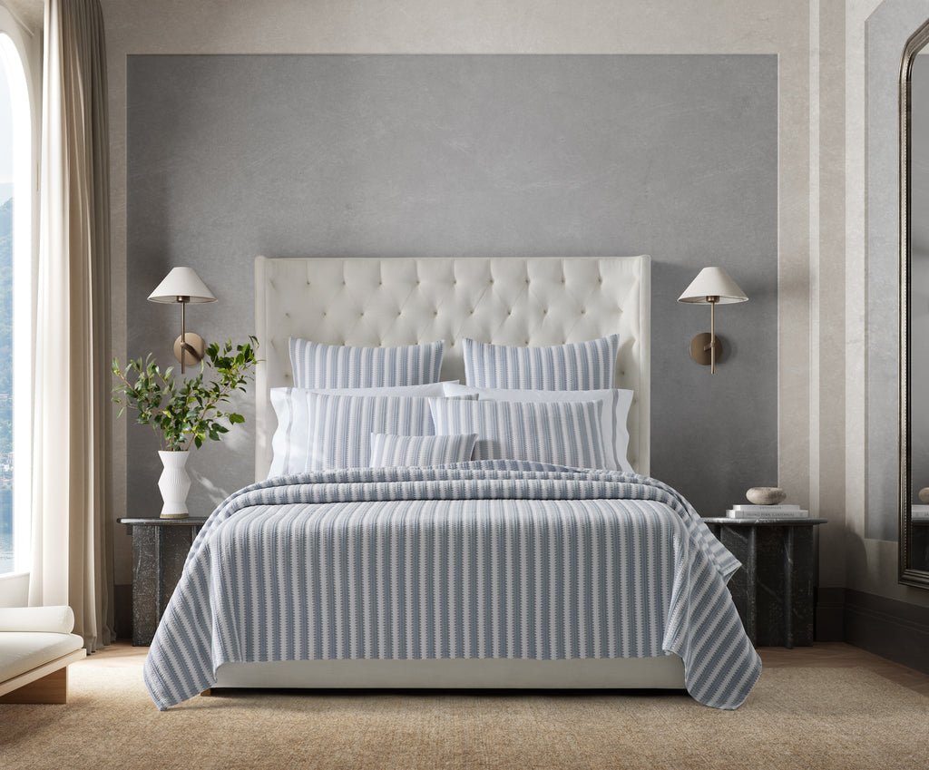 Expertly crafted in the USA with luxurious Italian fabric, Matouk's Apollo Stripe Matelassé coverlet and shams offer a comfortable and casual addition to your bedding. The 100% cotton shell and poly fill provide a minimal yet textural layer in a choice of Comet taupe or Dove blue & grey hues.