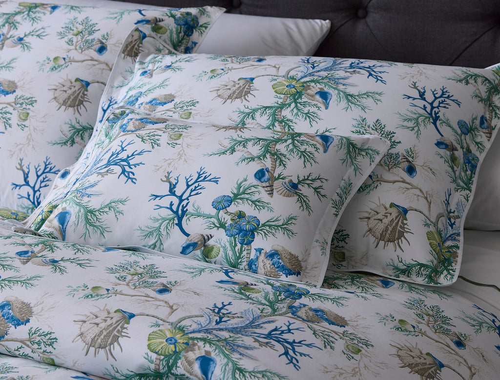 Experience the ultimate luxury with Del Tesoro sheets, duvet covers, and shams. Celebrating the underwater world with vibrant sea blue coral and playful motifs, this collection is crafted from luxurious Egyptian cotton, woven and printed in Italy. Elevate your bedding to new depths of elegance and sophistication