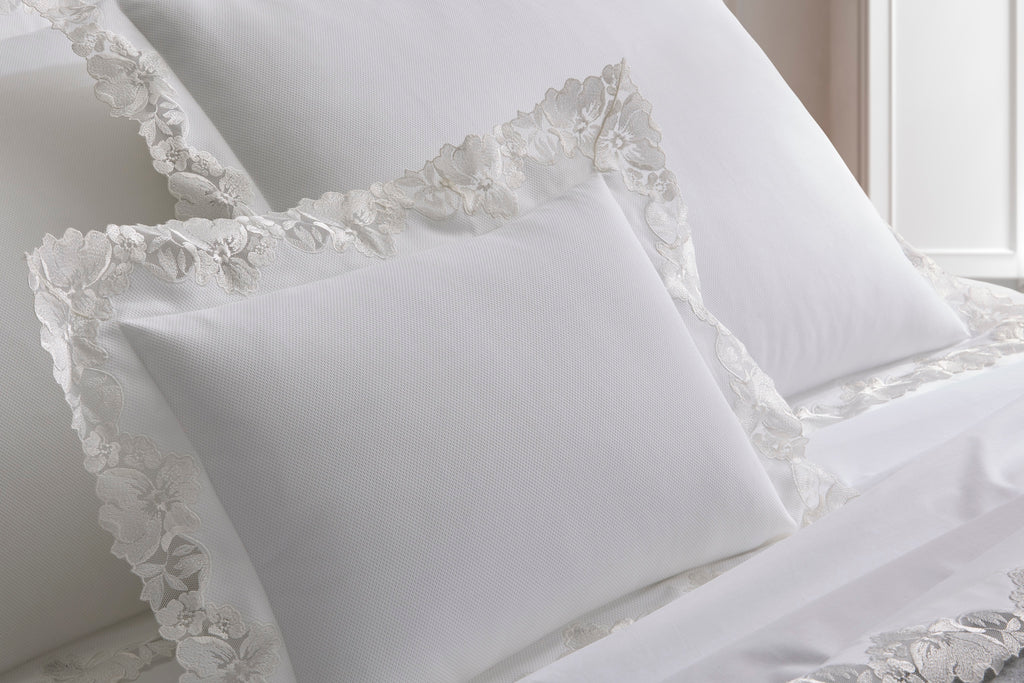 Simple elegance is created with Matouk's Virginia Lace Pique Coverlet + Shams. Made from 100% cotton pique with exquisite Swiss lace detailing, this lightweight coverlet adds a feminine and romantic touch to any bed.