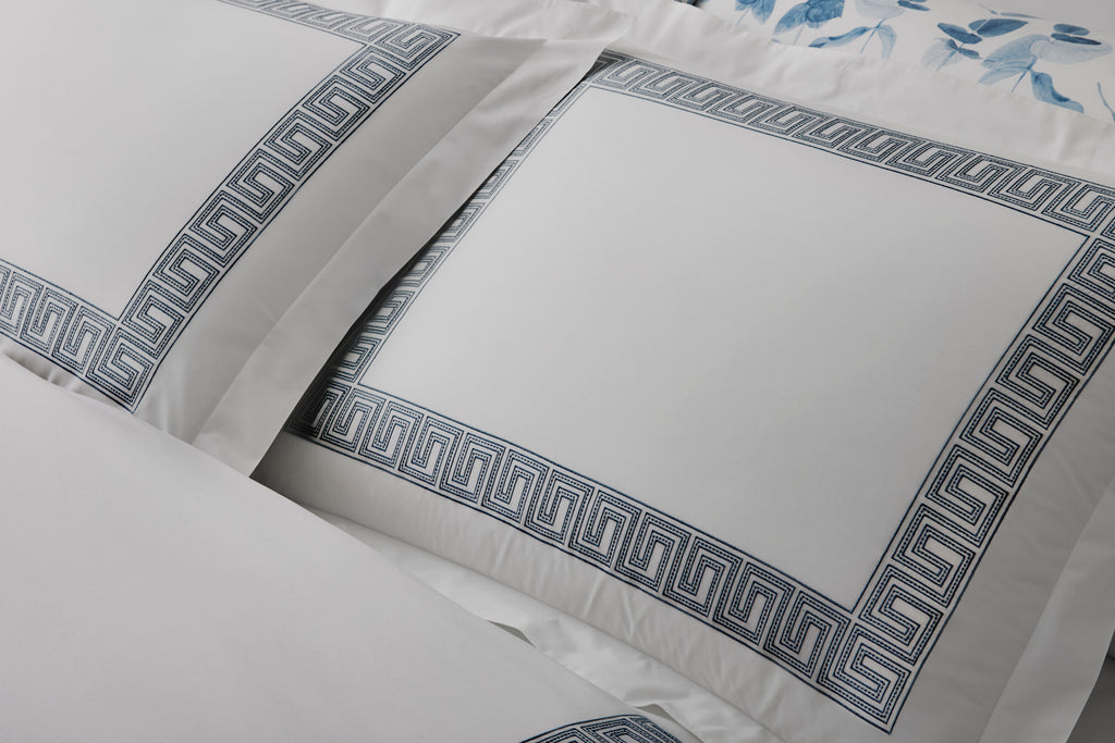 Experience the luxury of Matouk's Ophelia Flat Sheet. Crafted from crisp white 520 thread count Ceylon percale, these sheets feature a timeless Greek pattern reimagined with intricate embroidery. Mix and match with an array of colors for a stunning addition to any bedroom.