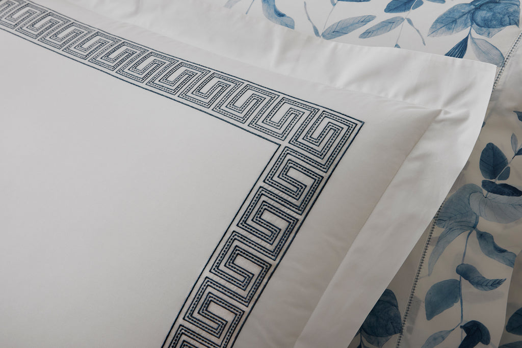 Experience the luxury of Matouk's Ophelia Flat Sheet. Crafted from crisp white 520 thread count Ceylon percale, these sheets feature a timeless Greek pattern reimagined with intricate embroidery. Mix and match with an array of colors for a stunning addition to any bedroom.