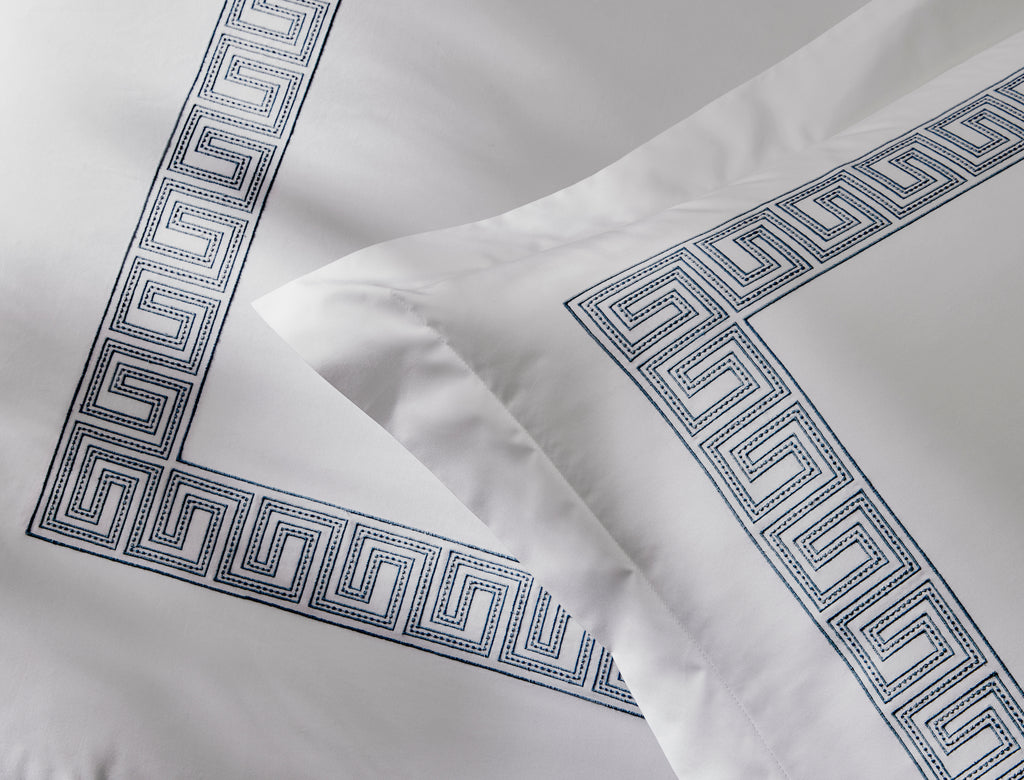 Experience the luxury of Matouk's Ophelia Flat Sheet. Crafted from crisp white 520 thread count Ceylon percale, these sheets feature a timeless Greek pattern reimagined with intricate embroidery. Mix and match with an array of colors for a stunning addition to any bedroom.