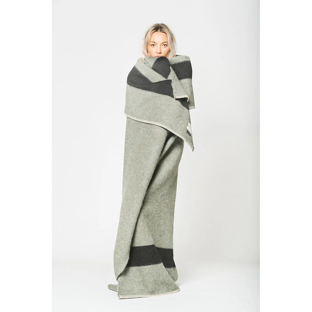 Expertly crafted with sustainability in mind, The Siempre Recycled Blanket from Blacksaw is the perfect addition to any fireside evening. Made from 100% recycled, eco-friendly fibers, this heavyweight blanket not only provides warmth but also helps reduce waste in landfills. Snuggle up guilt free.