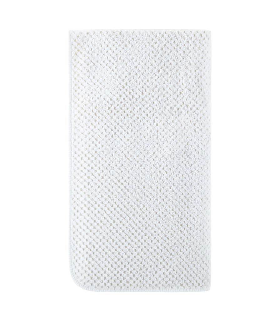 Introducing Catalina Bath Towels, made from 100% cotton and weighing 565 grams for a luxurious feel. Imported from Portugal, these towels feature a two-tone checkerboard design with white trim and rounded corners. Hang easily with the towel loop for convenience.