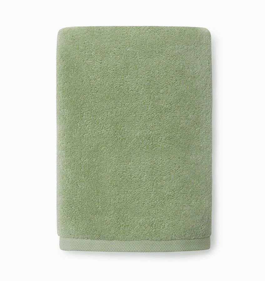 Experience the ultimate in comfort with Sferra's Cielo bath towels and tub mat. Made with the finest long staple cotton and zero-twist yarn, these towels are incredibly absorbent and feel weightless. The result? A heavenly softness that shines with a lustrous surface and catches the light. Indulge in luxury every time you use them. Palm Green Hand Towel