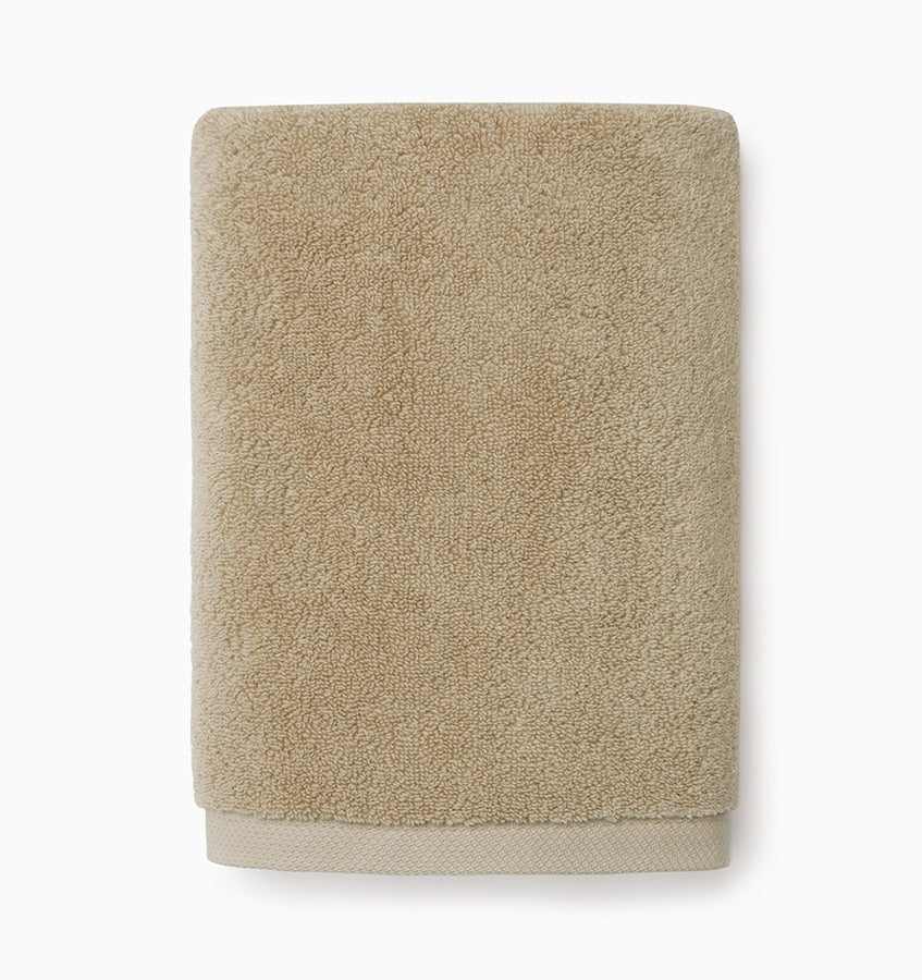 Experience the ultimate in comfort with Sferra's Cielo bath towels and tub mat. Made with the finest long staple cotton and zero-twist yarn, these towels are incredibly absorbent and feel weightless. The result? A heavenly softness that shines with a lustrous surface and catches the light. Indulge in luxury every time you use them. Sand Beige Hand Towel