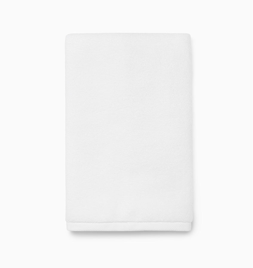 Experience the ultimate in comfort with Sferra's Cielo bath towels and tub mat. Made with the finest long staple cotton and zero-twist yarn, these towels are incredibly absorbent and feel weightless. The result? A heavenly softness that shines with a lustrous surface and catches the light. Indulge in luxury every time you use them. White Hand Towel