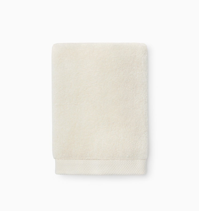 Experience the ultimate in comfort with Sferra's Cielo bath towels and tub mat. Made with the finest long staple cotton and zero-twist yarn, these towels are incredibly absorbent and feel weightless. The result? A heavenly softness that shines with a lustrous surface and catches the light. Indulge in luxury every time you use them. IVORY Wash Cloth