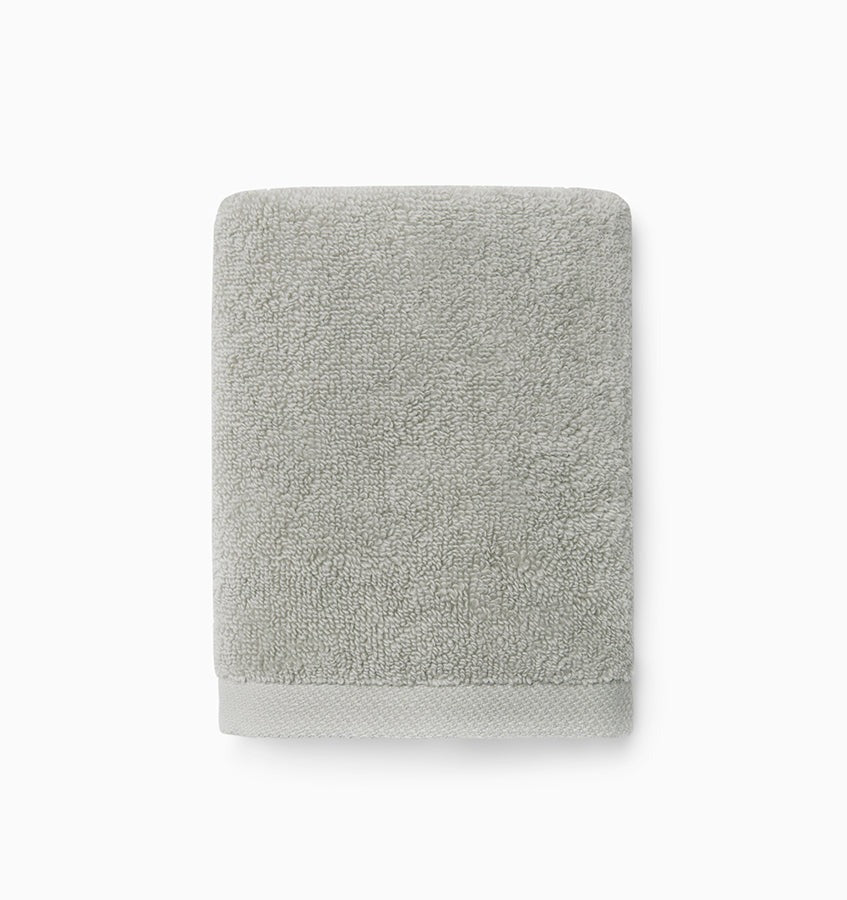 Experience the ultimate in comfort with Sferra's Cielo bath towels and tub mat. Made with the finest long staple cotton and zero-twist yarn, these towels are incredibly absorbent and feel weightless. The result? A heavenly softness that shines with a lustrous surface and catches the light. Indulge in luxury every time you use them. Platinum Silver Wash Cloth