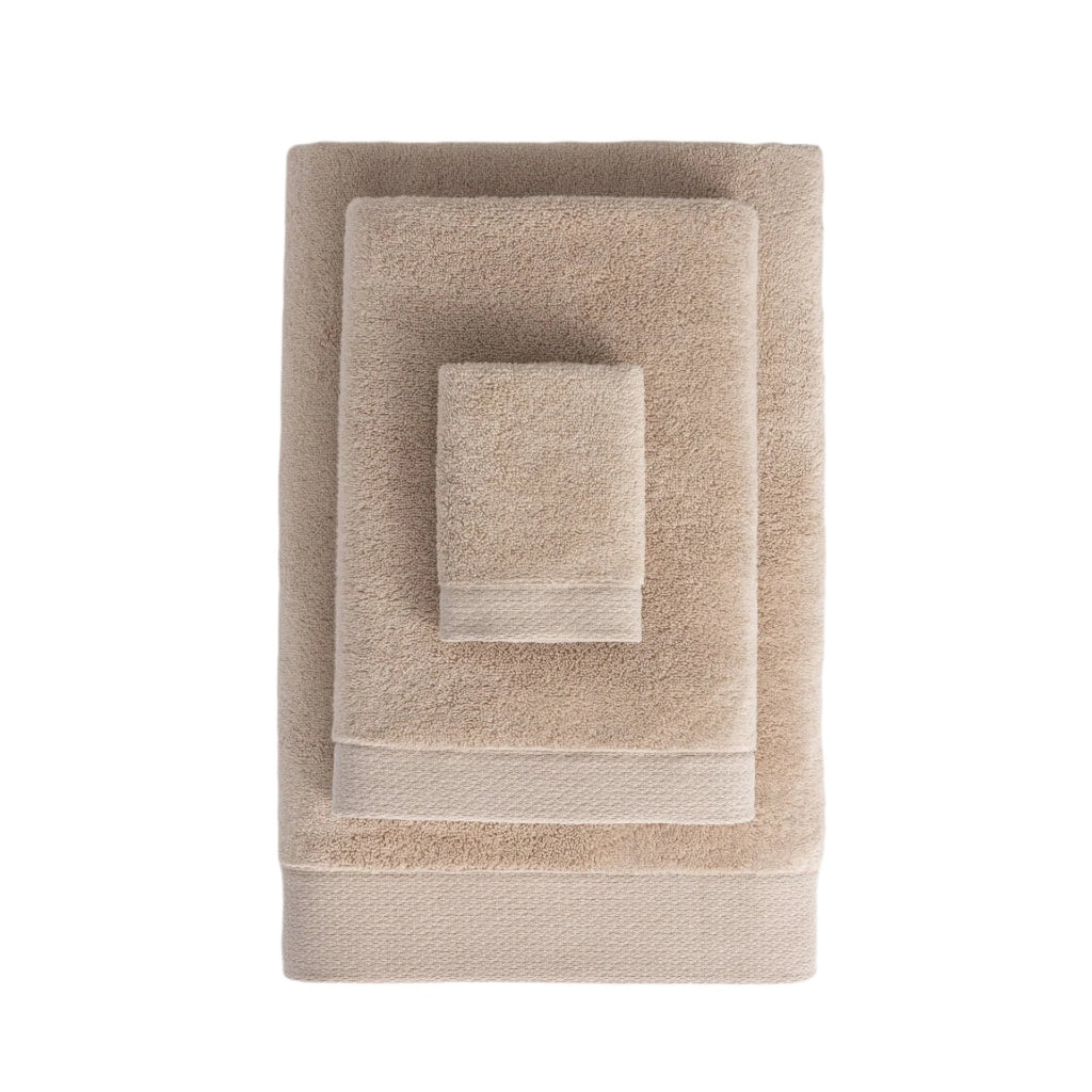 Scandia Home's Cosima Bath Towels are made from 100% long staple combed Turkish cotton, offering a soft, absorbent texture thanks to zero-twist construction. The jacquard woven border and diamond-notch pattern add an elegant touch. Fast drying and OEKO-TEX® STANDARD 100 certified, these towels are practical and posh. Linen beige