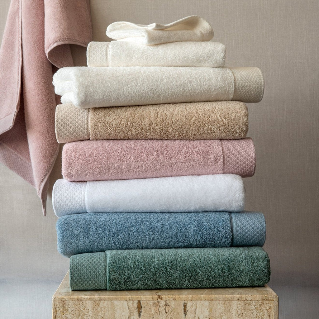 Scandia Home's Cosima Bath Towels are made from 100% long staple combed Turkish cotton, offering a soft, absorbent texture thanks to zero-twist construction. The jacquard woven border and diamond-notch pattern add an elegant touch. Fast drying and OEKO-TEX® STANDARD 100 certified, these towels are practical and posh.