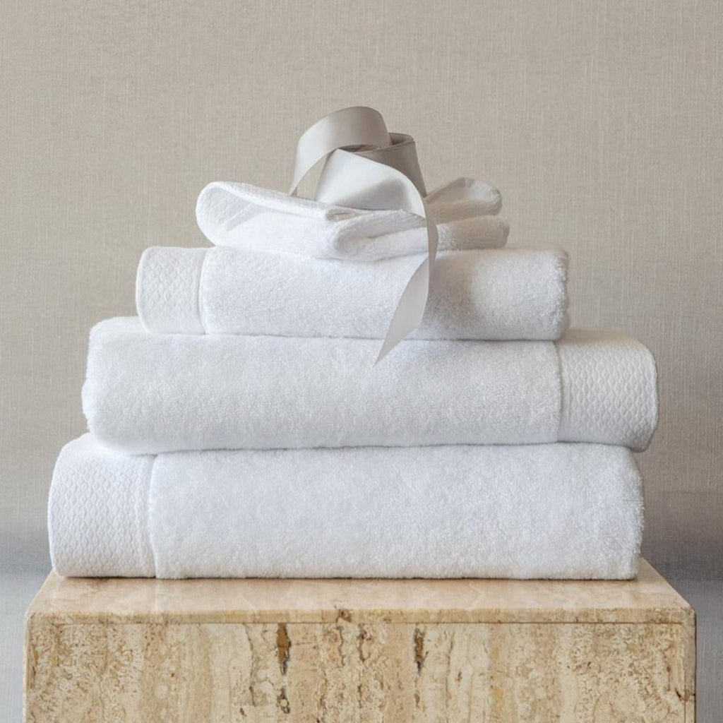 Scandia Home's Cosima Bath Towels are made from 100% long staple combed Turkish cotton, offering a soft, absorbent texture thanks to zero-twist construction. The jacquard woven border and diamond-notch pattern add an elegant touch. Fast drying and OEKO-TEX® STANDARD 100 certified, these towels are practical and posh.