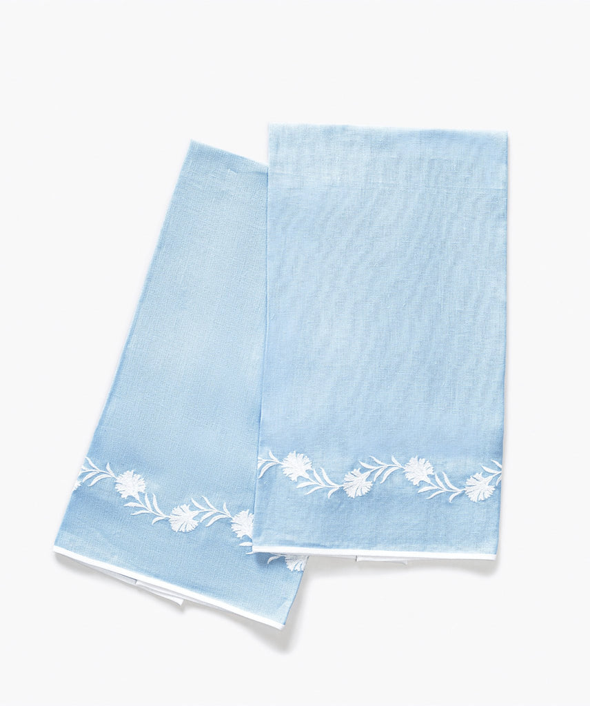 Matouk Daphne Guest Towels in Azure Blue linen with white floral embroidery