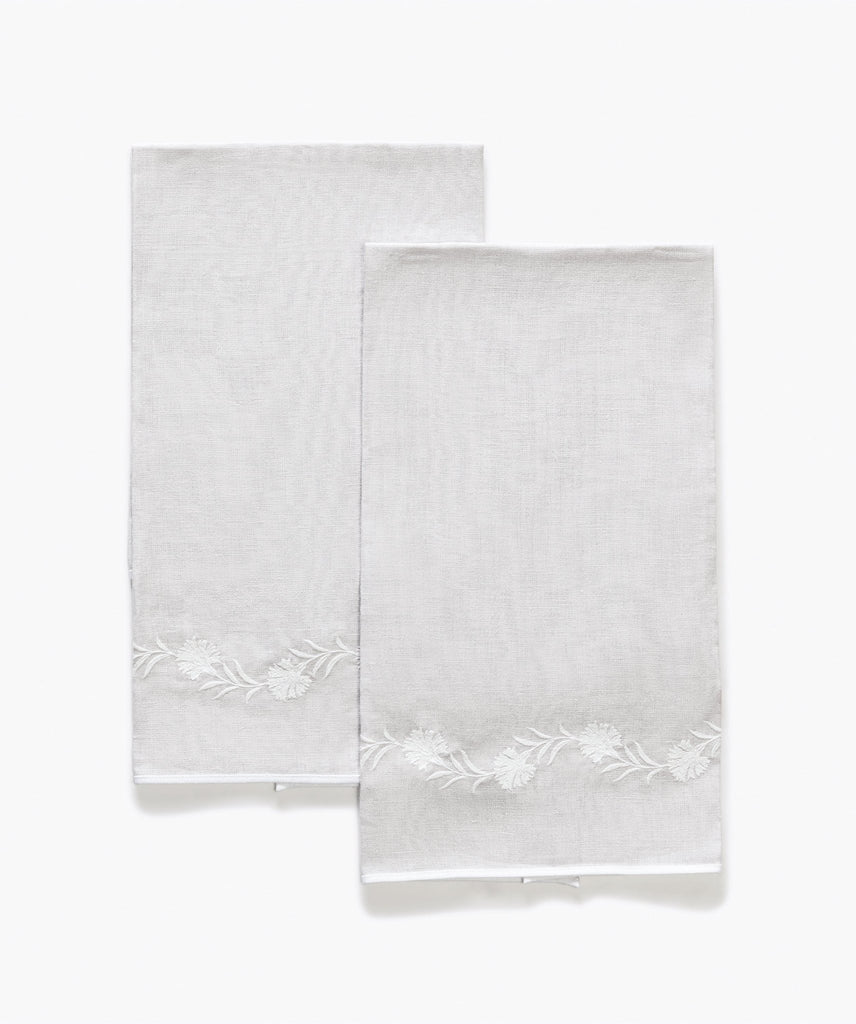 Matouk Daphne Guest Towels in Quartz silver light grey linen with white floral embroidery