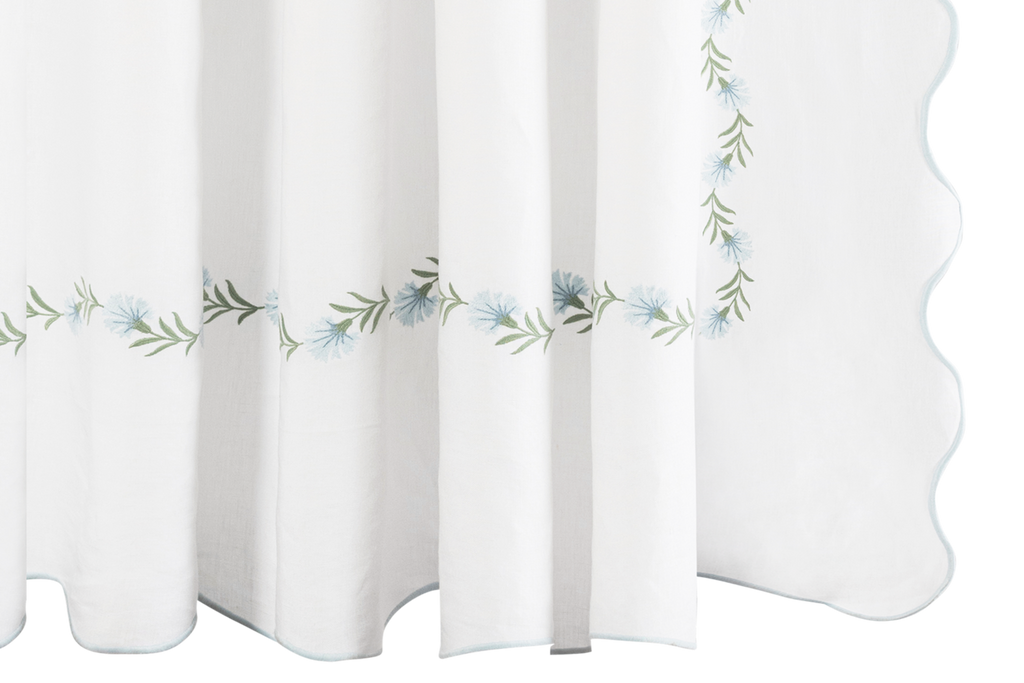 Elevate your bathroom with Matouk's Daphne Shower Curtain. Crafted from 100% linen, it features intricate bluebell floral embroidery for an elegant touch. Designed in the Philippines with fabric from Portugal, this shower curtain is also certified by OEKO-TEX® Standard 100. Enjoy the joy and durability it brings to your home.