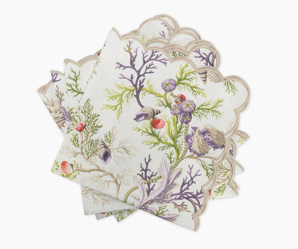 Matouk Schumacher Del Tesoro Linen Napkins feature sea life and coral print on linen finished with a linen embroidered scallop edge