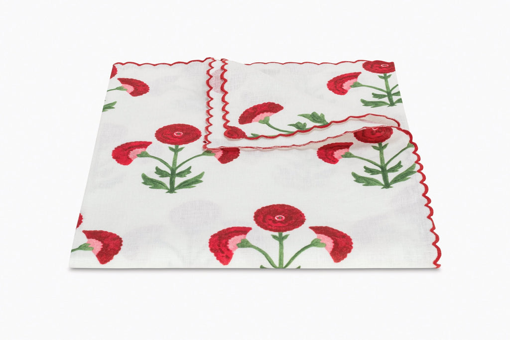 Matouk Gisele Tablecloth in Scarlet Red with a white linen background and red block print flowers and red thread embroidered scallop edge