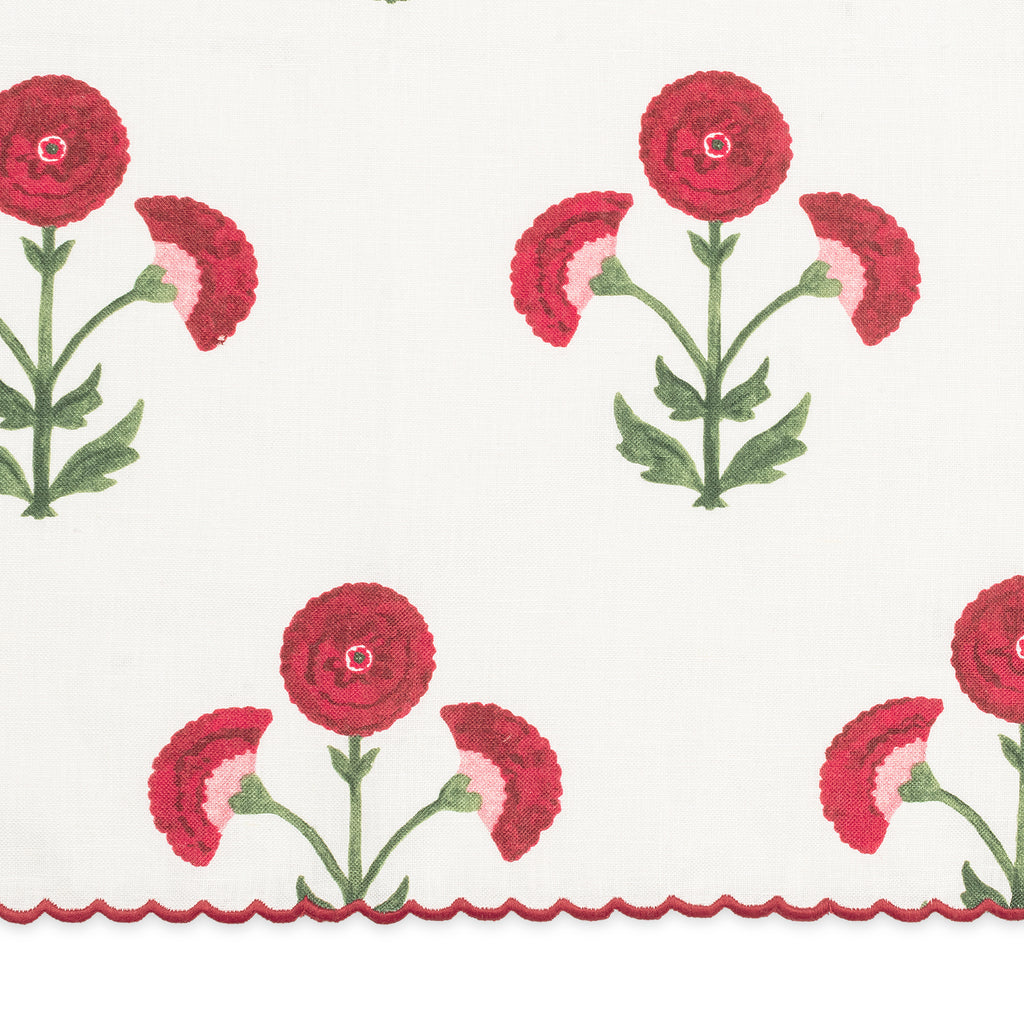 Matouk Gisele Fabric Swatch in Scarlet Red with a white linen background and red block print flowers and red thread embroidered scallop edge