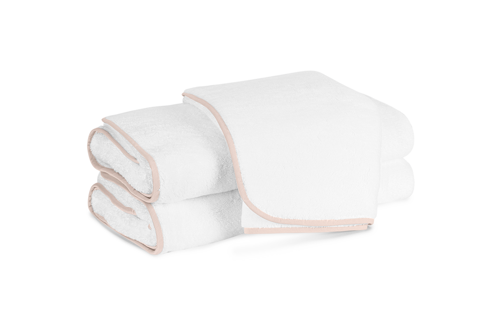 Matouk's Giza bath towels feature cotton that is grown in Egypt, woven in Portugal, then sewn in the USA. Giza is the best quality extra long staple cotton. This extraordinary Egyptian cotton is grown in the Nile River Valley, producing a product that is soft and smooth to the hand and ultra absorbent and long-lasting. White Terry with Blush Pink Trim