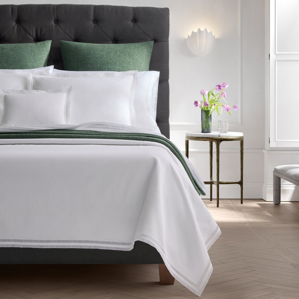 Introducing the Grace Lace Pique Coverlet and Shams from Matouk, a perfect combination of timeless style and intricate detailing. Made with 100% cotton pique and finished with delicate white Swiss lace, this lightweight layer adds a polished finish to any bed.