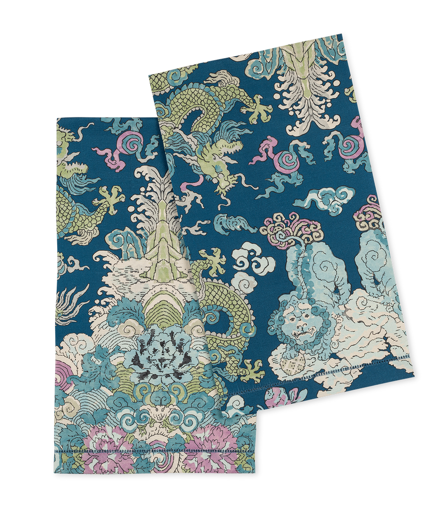 Transform your bathroom into a mystical oasis with Magic Mountain Guest Towels. The Schumacher pattern showcases a fantastical land and ethereal color palette, while the elegant linen and hemstitch finish add a touch of sophistication. Indulge your guests with these enchanting and show-stopping towels. Color: Aquarius - Blue, green, pink