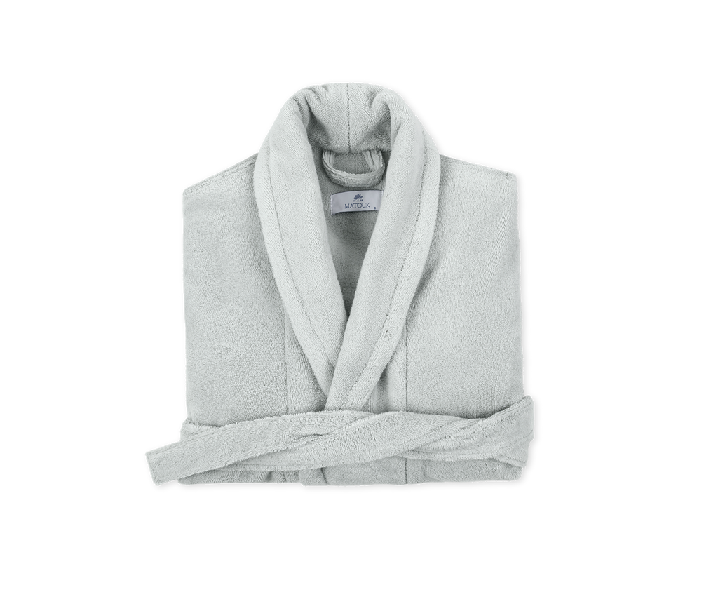 Introducing the luxuriously soft and cozy Milagro Bath Robe from Matouk. Made with 100% zero twist cotton, this unisex robe features a shawl collar and two ample sized pockets. Available in Pool Silver/Blue this robe is the perfect addition to your daily routine. Made in Turkey.