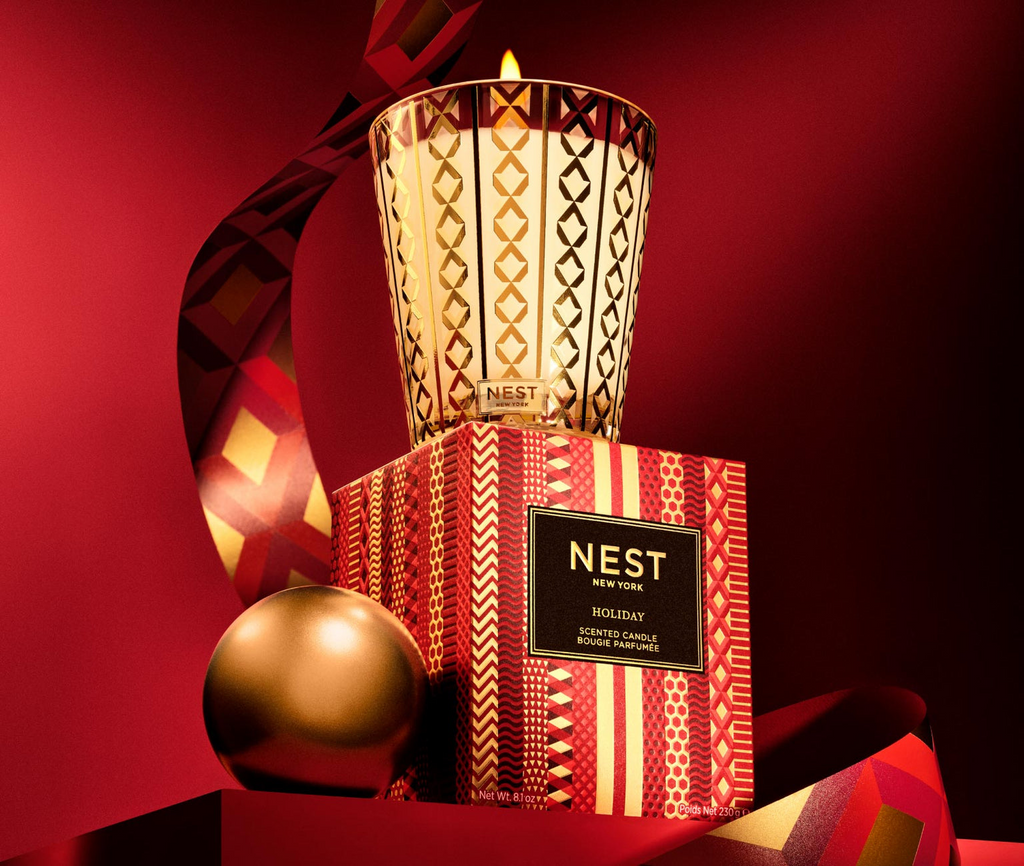 Get in the holiday spirit with Nest's bestselling Holiday Classic Candle! With festive and fruity notes of pomegranate, mandarin orange, pine, cloves, and cinnamon, this candle brings the quintessential aroma of the season to your home. Made with clean-burning, cruelty-free wax and a reusable glass holder, it's perfect for cozy winter nights.