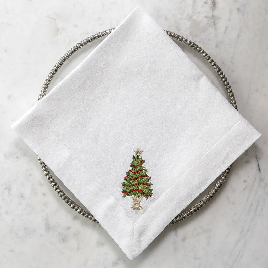 Arte Italica Crown Linens Tree with Trim Large Linen Napkin in white linen with green christmas tree and red garland