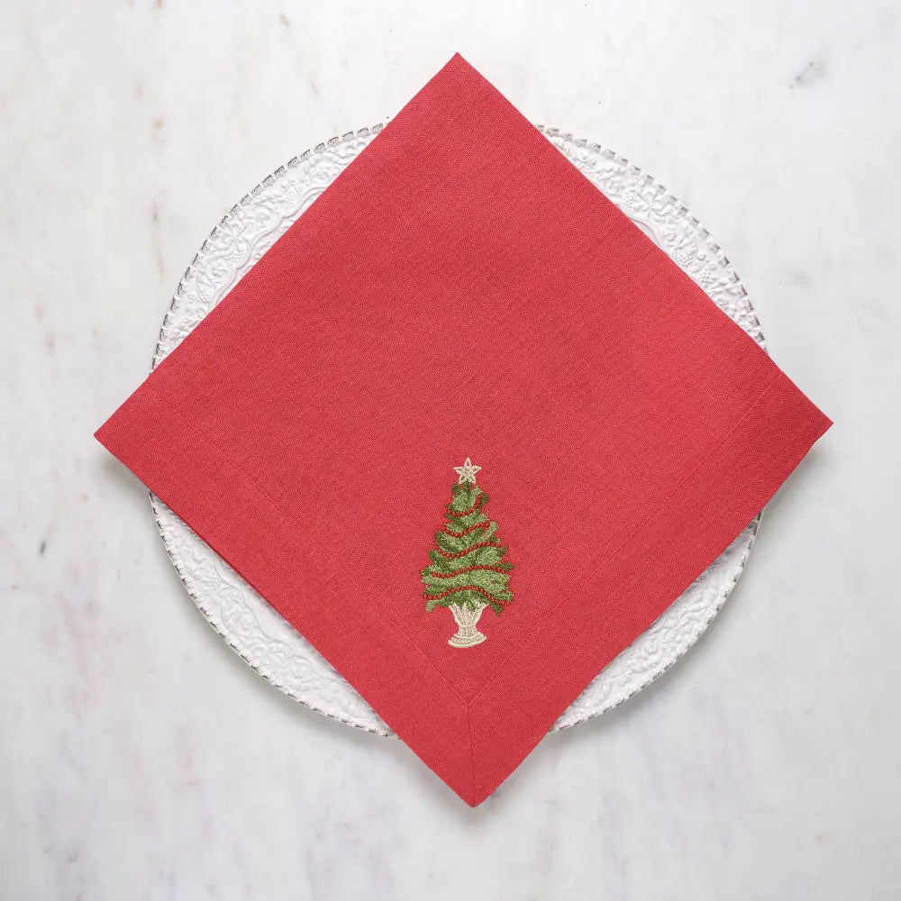 Arte Italica Crown Linens Tree with Trim Large Linen Napkin in red linen with green christmas tree and red garland