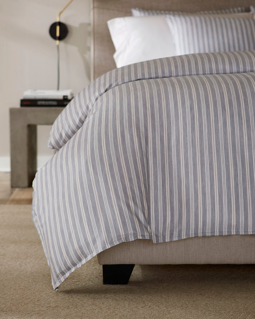 Indulge in luxury with our Leranto Sheets, Duvet Covers + Shams. Made from 100% extra long-staple cotton, the yarn-dyed sateen jacquard fabric gives a softly textured feel. The minimalist palette of titanium, adorned with understated stripes, exudes elegance and sophistication. Made in Italy.