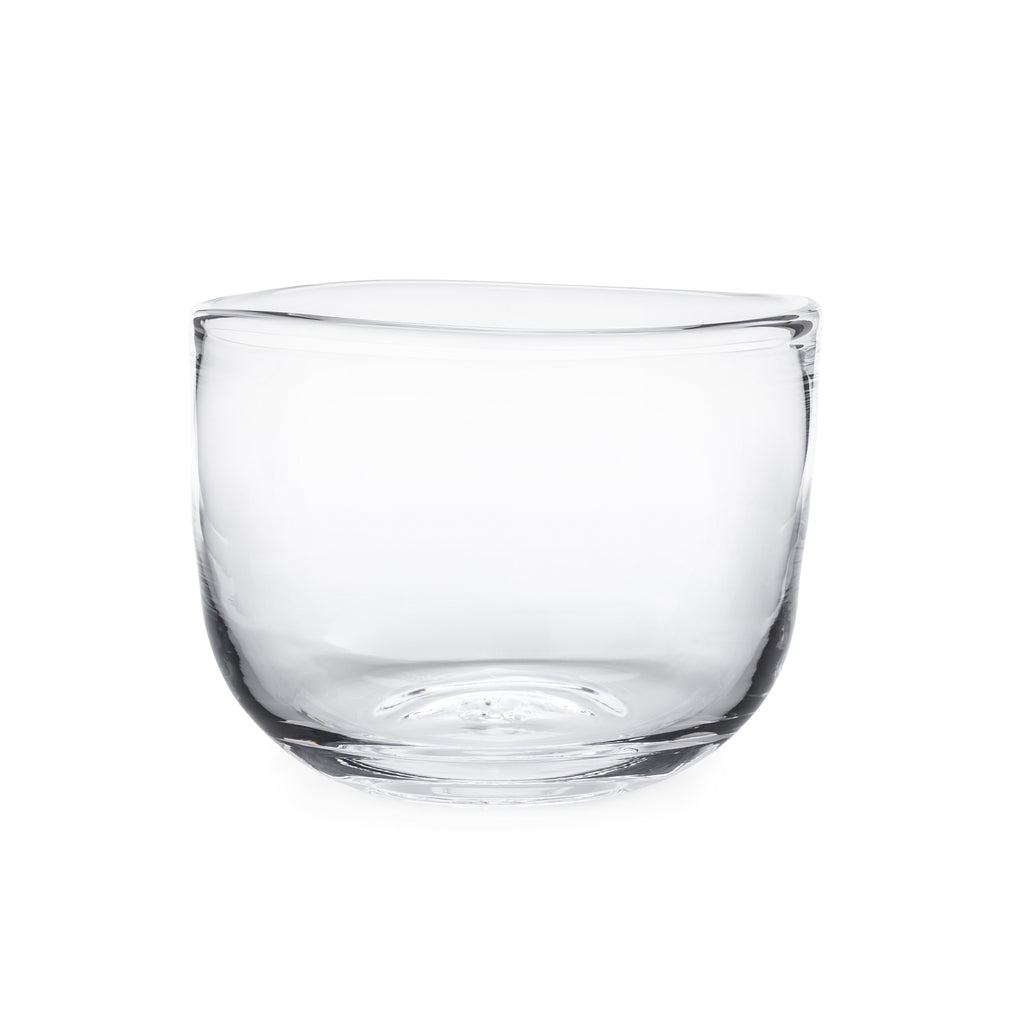 Experience the natural, artisanal charm of Burlington with our inspired glass bowl from Simon Pearce. Its handcrafted design gives it a lively, imperfect feel, making it perfect for both simple centerpieces and as a beautiful salad bowl. Its free-flowing lines and organic shape add a touch of fluidity to any setting.